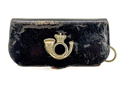Lot 585 - A late Victorian black leather light infantry ammunition pouch.