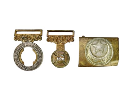 Lot 570 - A brass and silvered military buckle, The Wiltshire Regiment.