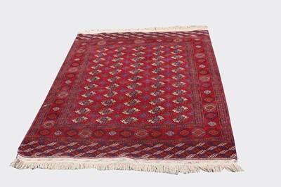 Lot 468 - A Bokhara carpet, the madder field with eleven...