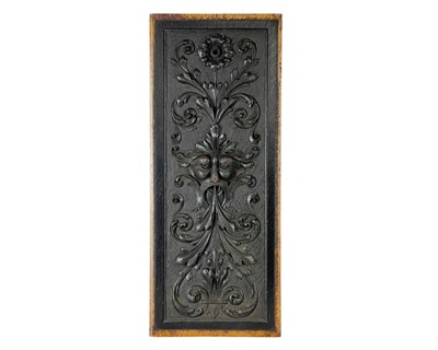 Lot 16 - A carved oak green man panel.