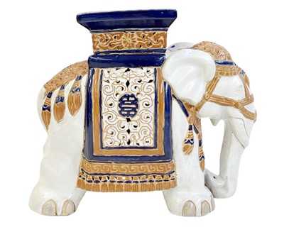 Lot 771 - An Eastern pottery elephant garden seat or stand.
