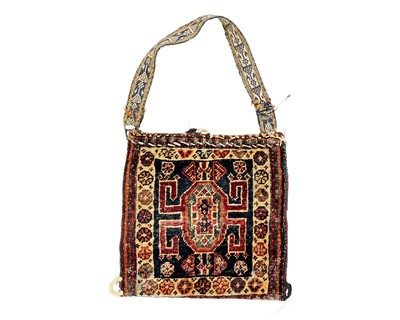 Lot 699 - A carpet saddle bag.