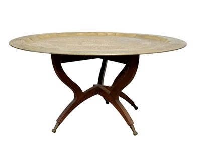 Lot 417 - A circular brass tray table.