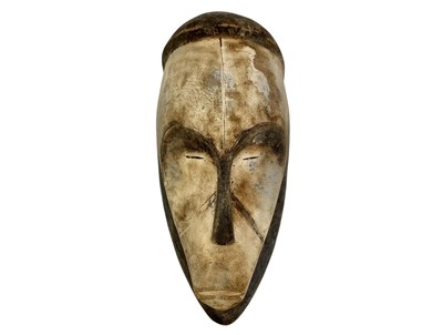Lot 39 - Three carved wood African Fang masks.
