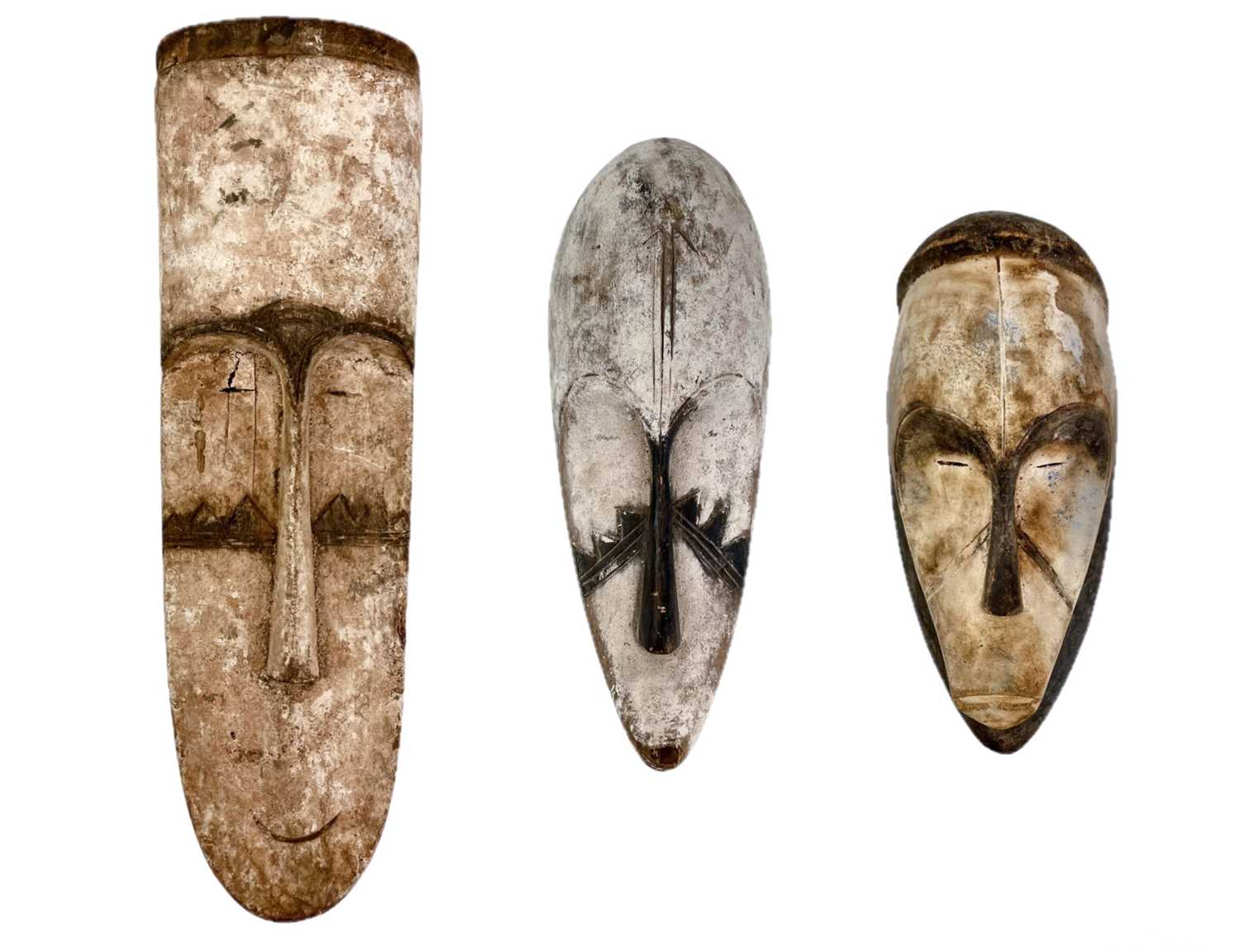 Lot 39 - Three carved wood African Fang masks.