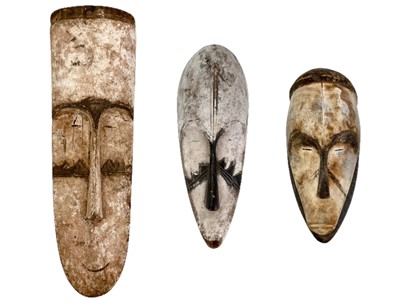 Lot 39 - Three carved wood African Fang masks.