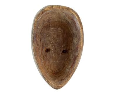 Lot 37 - A polychrome African mask.
