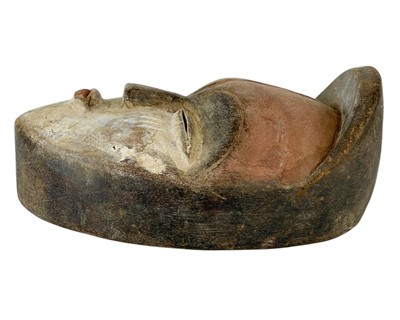Lot 37 - A polychrome African mask.