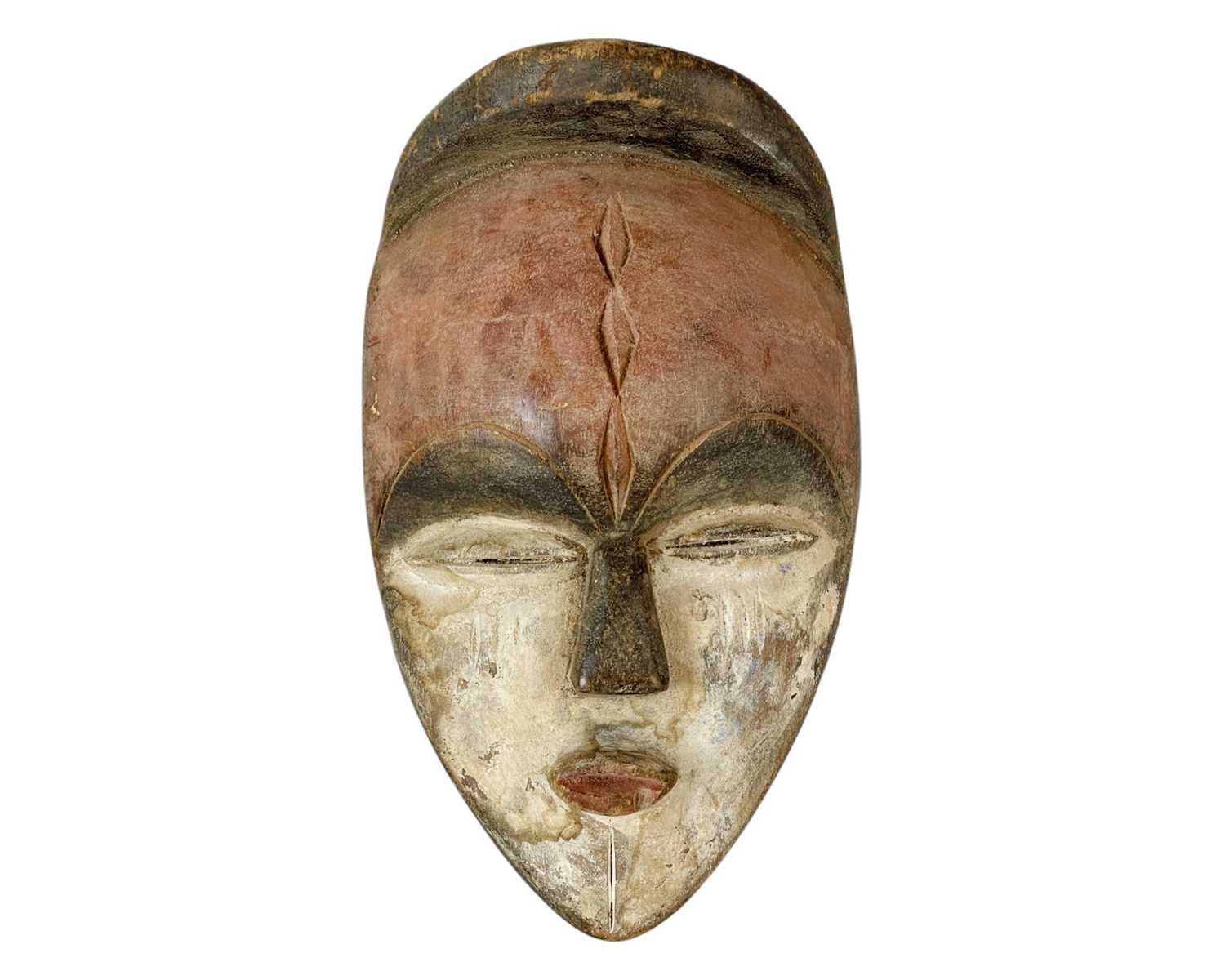 Lot 37 - A polychrome African mask.