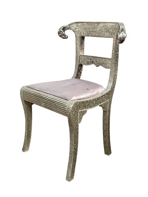 Lot 770 - An Anglo-Indian white metal clad 'wedding' chair.