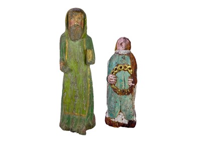 Lot 114 - Two 17th century French carved wood polychrome painted figures.