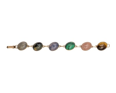 Lot 32 - A 9k rose gold bracelet set with various quartz gems.