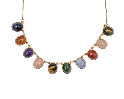 Lot 31 - A 9k necklace set with ten various quartz oval cabochon gems.