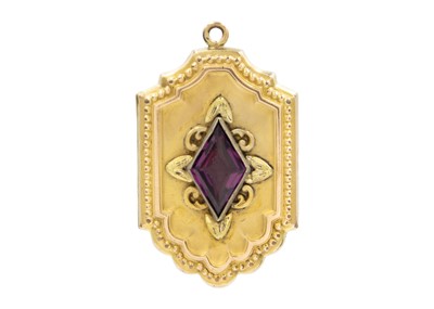 Lot 39 - A gold-plated purple paste set locket fob.