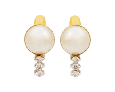 Lot 75 - A 14k gold pair of diamond and cultured pearl set earrings.