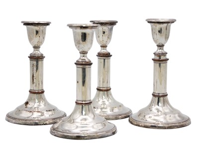 Lot 217 - A set of four Sheffield silver-plated telescopic candlesticks.