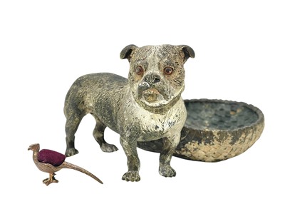 Lot 21 - An Austrian cold painted bronze trinket dish as a pug with a basket.