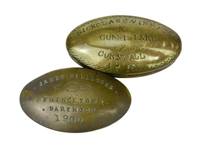 Lot 151 - Two West country brass miner's oval snuff boxes.