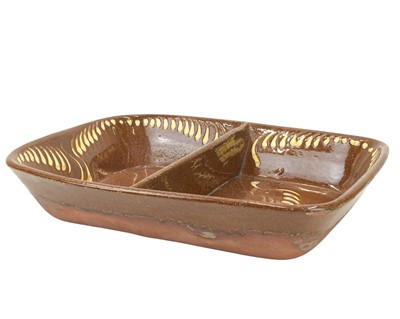Lot 237 - A slipware decorated baking dish.