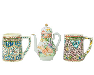Lot 250 - Two Iznik pottery mugs.