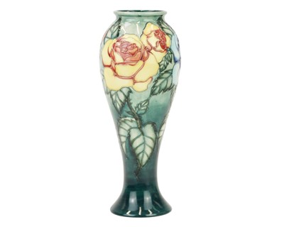 Lot 277 - A Moorcroft 'Rose and Bud' pattern vase.