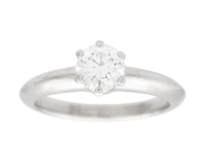 Lot 11 - TIFFANY & CO - A good platinum 0.59ct diamond solitaire ring with certificate and box.