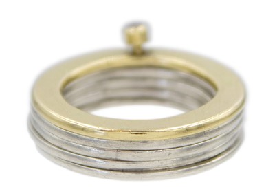 Lot 12 - A diamond set silver and yellow gold stacking ring in a box.