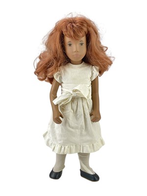 Lot 556 - A vinyl Sasha red head doll.