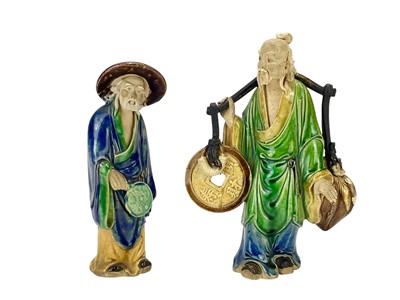 Lot 759 - A Chinese Shiwan mudman figure.