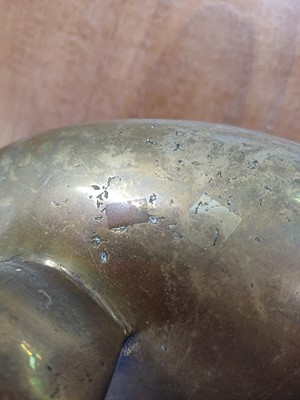 Lot 714 - A Chinese polished bronze tripod 'dragon' censer.