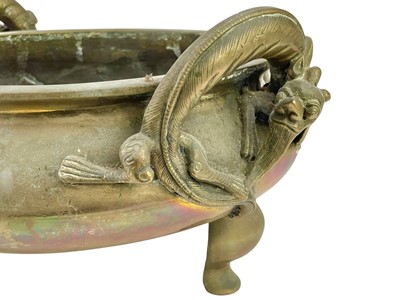 Lot 714 - A Chinese polished bronze tripod 'dragon' censer.