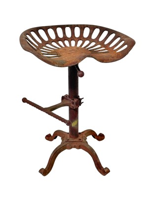 Lot 104 - A cast iron tractor seat stool.