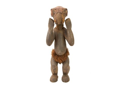 Lot 127 - A carved wood tribal figure.