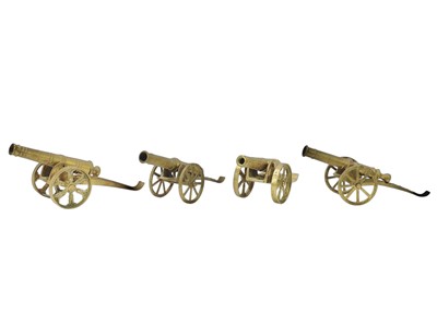 Lot 22 - Four brass model desk cannons.