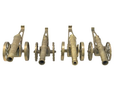 Lot 22 - Four brass model desk cannons.