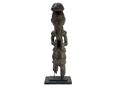 Lot 128 - An African carved wood tribal figure.