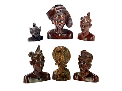 Lot 86 - Six Balinese carved wood busts.