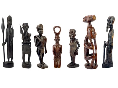 Lot 122 - A collection of carved hardwood figures.