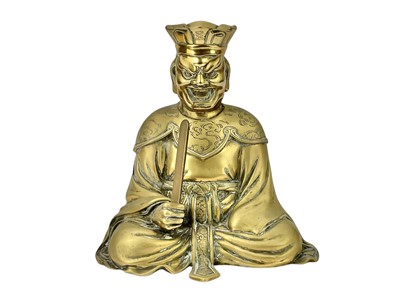Lot 644 - A Chinese polished brass figure of a god of wealth.
