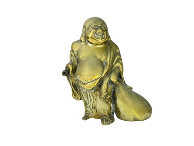 Lot 687 - A Japanese polished brass figure of Hotei.