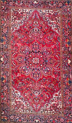 Lot 616 - A Persian Heriz carpet.