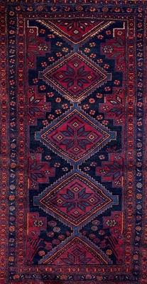 Lot 686 - A Hamadan carpet.