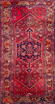 Lot 628 - A Hamadan carpet.