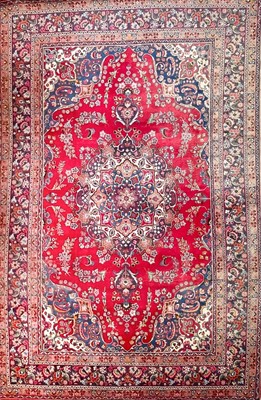 Lot 603 - A Persian Kashan carpet.