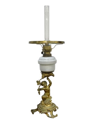 Lot 61 - A 19th century gilt brass cherub oil lamp.