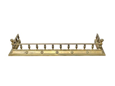 Lot 421 - A late Victorian brass fender.