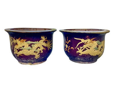 Lot 759 - A near pair of Eastern pottery planters.