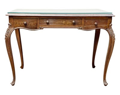 Lot 437 - A Walnut writing table.