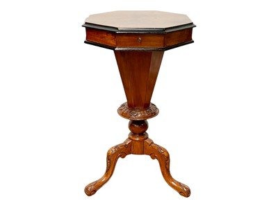 Lot 420 - A Victorian figured walnut octagonal work or sewing table.