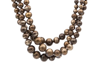 Lot 51 - A Mexican three-strand silver hollow bead necklace.